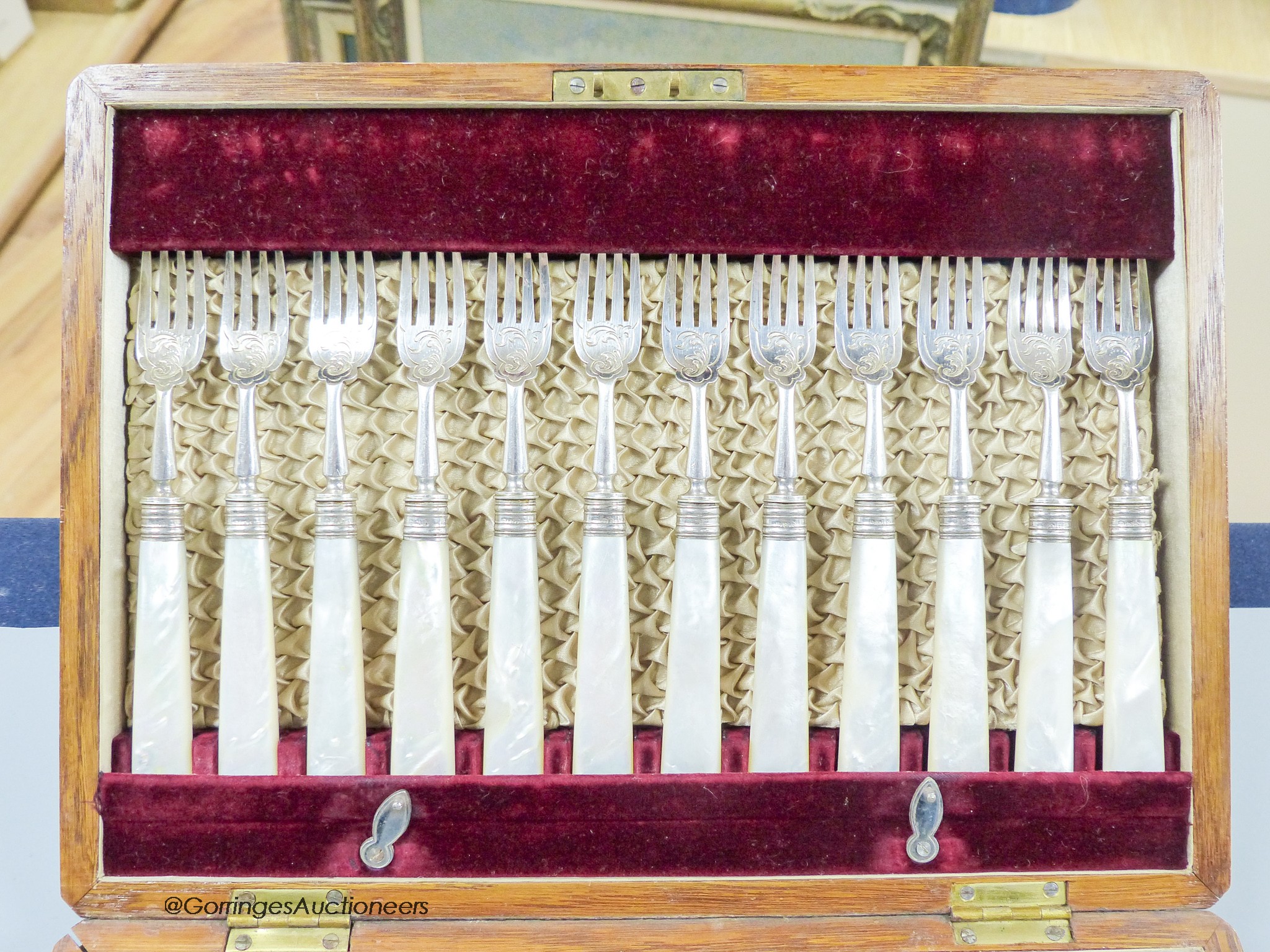 A cased set of twelve pairs of late Victorian mother of pearl handled silver dessert eaters, Z. Barraclough & Sons, Sheffield, 1896.